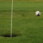 a modern simple gentleman's ball game on the golf course called footgolf