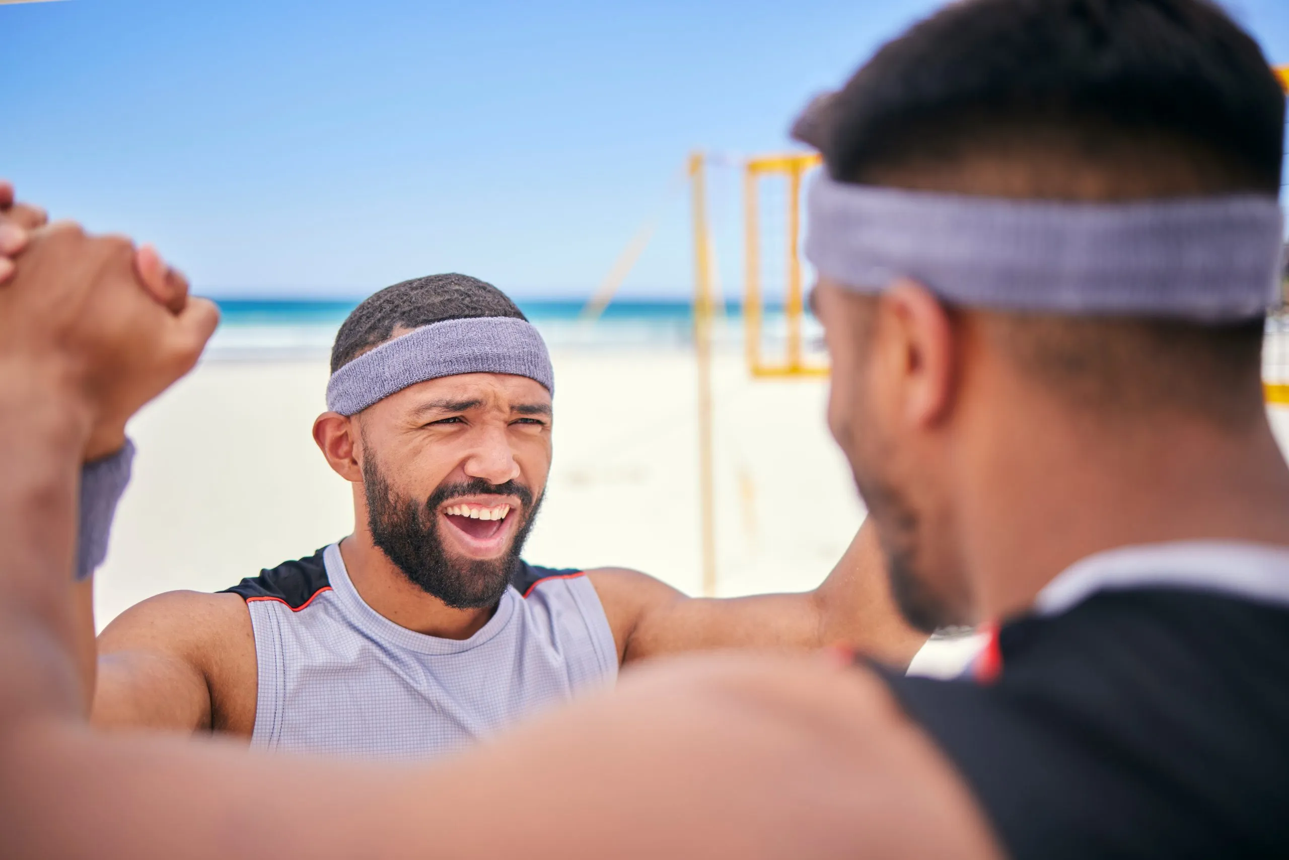 Happy man, volleyball and celebration on beach in winning, victory or match point in fitness, exercise or motivation. Excited male person in team sports, game or achievement in success on ocean coast
